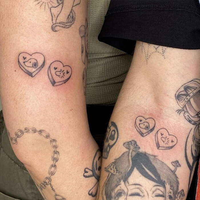 Friends with matching arm tattoos