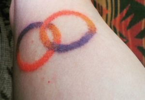 color stick and poke tattoo